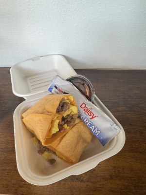 cheese tortilla + eggs + sausage + bacon + cheese