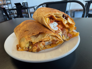 CHEESE TORTILLA + EGGS + SAUSAGE + BACON + POTATOES + SALSA + CHEESE